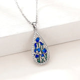 Blue enamel flower teardrop CZ necklace for women with pendant design for weddings, evening wear, and everyday styling.