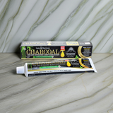 Charcoal Essential Toothpaste tube for tooth brushing, mouth care, and daily dental hygiene use.