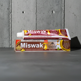 Miswak Essential Toothpaste tube for tooth brushing, mouth care, and daily dental hygiene use.