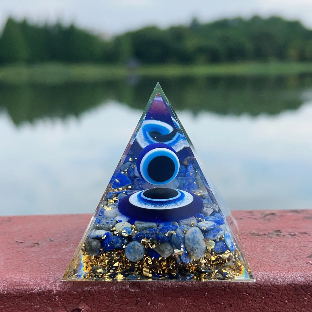 Evil Eye Lapis Lazuli Healing Crystal Pyramid for meditation, energy healing, and home décor.