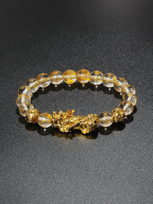Feng Shui wealth Obsidian Pi Xiu bead bracelet for attracting money energy and protective daily use.