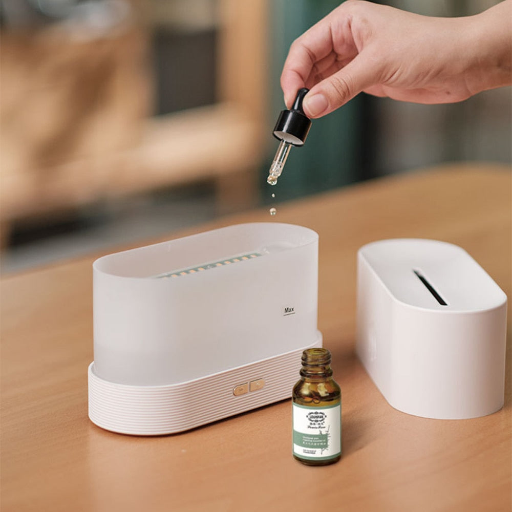 Flame effect aroma diffuser humidifier with LED light for essential oil diffusion, moisture balance, and cozy room ambiance.