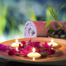Floating disc shape candles for spa decor, relaxing bath displays, and peaceful table ambiance.