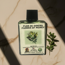 Flor De Dinero Wish Oil bottle for money drawing, altar work, and spiritual intention use.