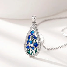 Floral blue enamel teardrop CZ necklace with pendant for special occasion styling, layering, and daily accessory wear.