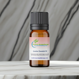 Floral jasmine essential oil glass bottle for scenting rooms, aromatherapy routines, and personal wellness use.