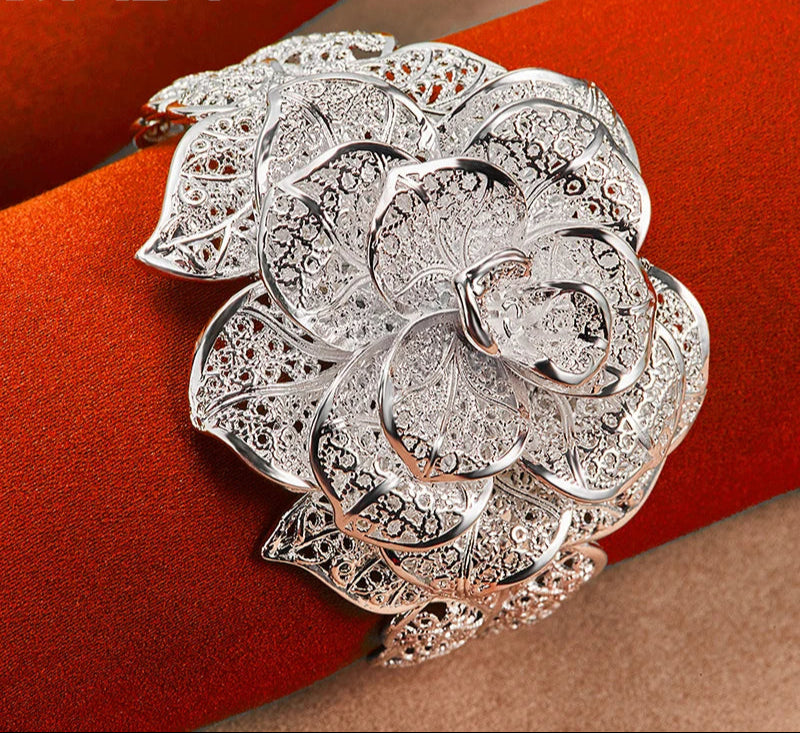 Floral sterling silver Camellia cuff bangle for refined outfit styling, party wear, and gift-ready jewelry use.