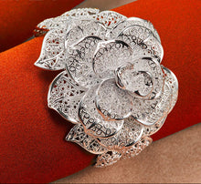 Floral sterling silver Camellia cuff bangle for refined outfit styling, party wear, and gift-ready jewelry use.