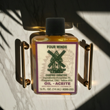 Four Winds Wish Oil bottle for candle dressing, wish work, and ceremonial ritual use.