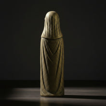 Frigg volcanic stone statue, side view