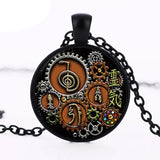 Vintage steampunk Reiki cabochon pendant with glass dome for spiritual expression, layered necklace styling, and daily wear.