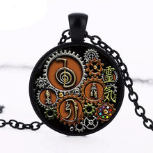 Vintage steampunk Reiki cabochon pendant with glass dome for spiritual expression, layered necklace styling, and daily wear.