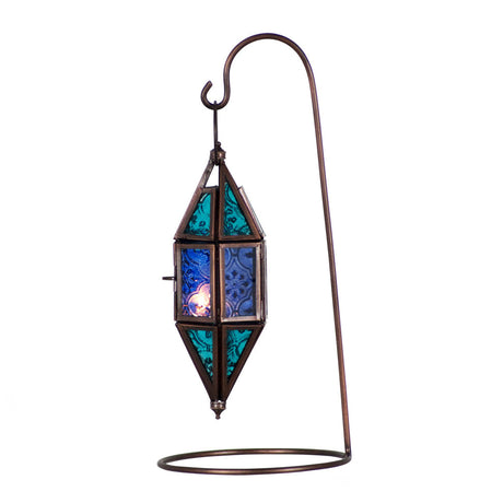 Glass and metal lantern in a chapel shape with aquamarine and blue glass panels