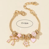 Gold butterfly heart rhinestone beaded bracelet for dressing up wrist stacks, date night looks, and trendy accessory wear.