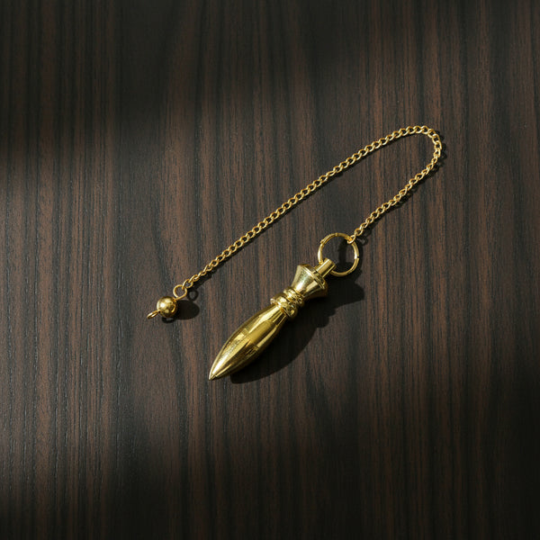 Gold finish bullet-shaped pendulum on a chain