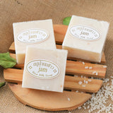 Gold JAM Thai Rice Milk Soap three handmade bars on wooden board for daily face and body brightening.