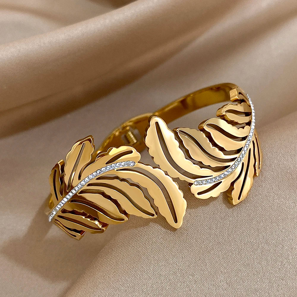 Slavena Gold Feather Rhinestone open cuff bracelet for special occasion accessorizing, chic looks, and standout jewelry wear.
