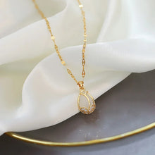Gold tulip rhinestone clavicle necklace for dressing up casual outfits, evening wear, and feminine styling.