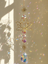 Golden Lotus Crystal Suncatcher hanging ornament for window decor, sunlight reflection, and peaceful home decoration.
