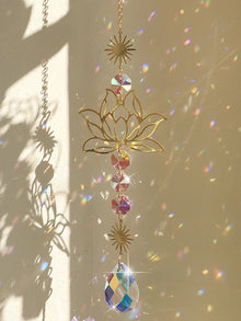 Golden Lotus Crystal Suncatcher hanging ornament for window decor, sunlight reflection, and peaceful home decoration.