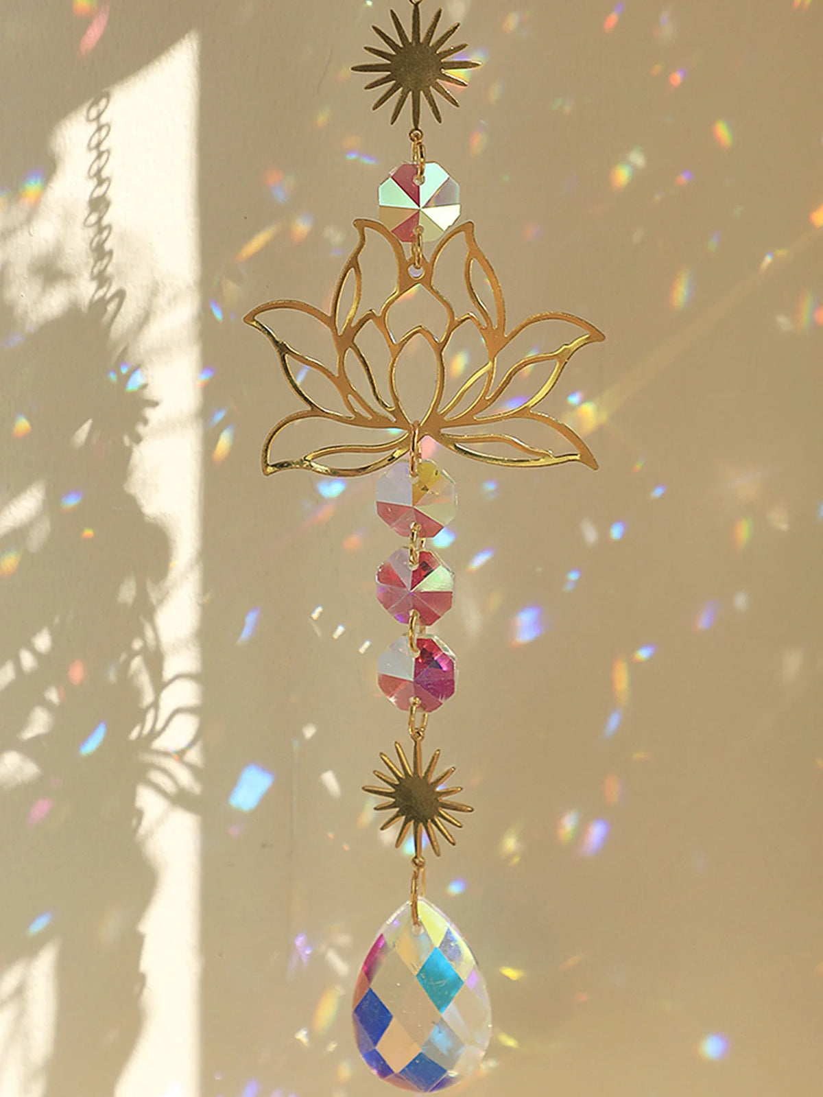 Golden Lotus Crystal Suncatcher prism ornament for hanging in windows, catching sunlight, and enhancing spiritual decor.