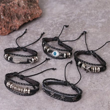 Gothic leather bracelet with skull and star accents for alternative fashion wear, layered jewelry styling, and casual outfits.