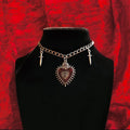 Gothic Y2K peach heart cross sword choker necklace for edgy fashion styling, alternative outfits, and statement accessory wear.