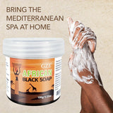 GZE African Black Soap 3-in-1 Cleanser hand applying soap lather on beige background showing texture.