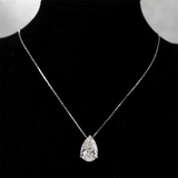 Pear-Cut Moissanite Pendant halo necklace with a pear-shaped center stone for formal occasions, bridal looks, and statement accessorizing.