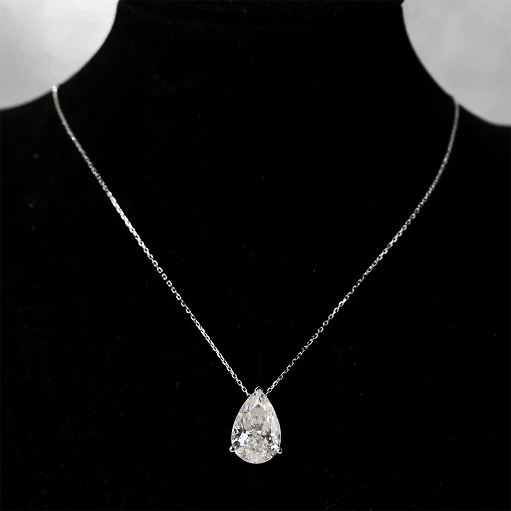Pear-Cut Moissanite Pendant halo necklace with a pear-shaped center stone for formal occasions, bridal looks, and statement accessorizing.