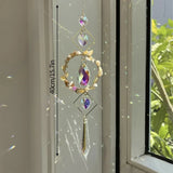Hamsa crystal rainbow window hanging for sunlit spaces, prism light effects, and protective-inspired home decor.