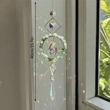 Hamsa crystal window prism ornament for catching natural light, producing rainbow effects, and decorative hanging use.