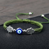 Hand of Fatima Evil Eye charm bracelet with red rope for spiritual protection, charm wear, and symbolic fashion use.