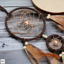 Handmade Indian Dream Catcher brown feather pendant for wall display, room decoration, and calming bohemian decor.