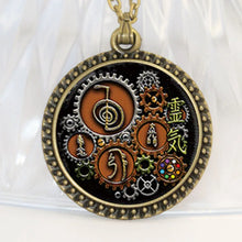 Handmade Reiki steampunk glass necklace pendant for healing rituals, mindful wear, and alternative fashion use.