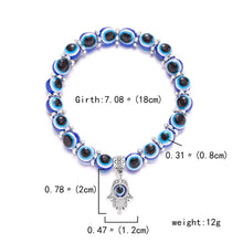Evil eye charm bracelet for personal protection, casual outfit styling, and meaningful jewelry use.