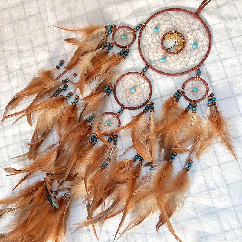Handwoven dream catcher with crystal wall decor for nursery decoration, calming interior styling, and symbolic home accents.