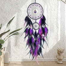 Hanging dreamcatcher with colorful feathers and crystals for wall hanging decor, restful sleep, and positive energy spaces.