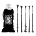 Harry Potter wand makeup brush set with wizard-inspired cosmetic brushes for applying foundation, blush, and eyeshadow.