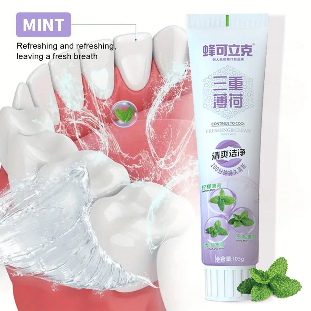Herbal Mint Toothpaste tube on dental-themed background for natural plaque prevention and whitening.