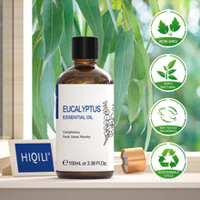 HIQILI Eucalyptus essential oil bottle beside eucalyptus foliage with non-GMO, natural and cruelty-free badges