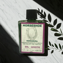 Horseshoe Wish Oil manifestation oil bottle for wish work, candle dressing, and intention setting.