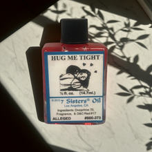 Hug Me Tight Wish Oil fragrance oil bottle for romance work, affection, and spiritual relationship support.