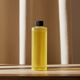 Invictus men’s body oil bottle for moisturizing skin, daily body care, and long-lasting fragrance wear.