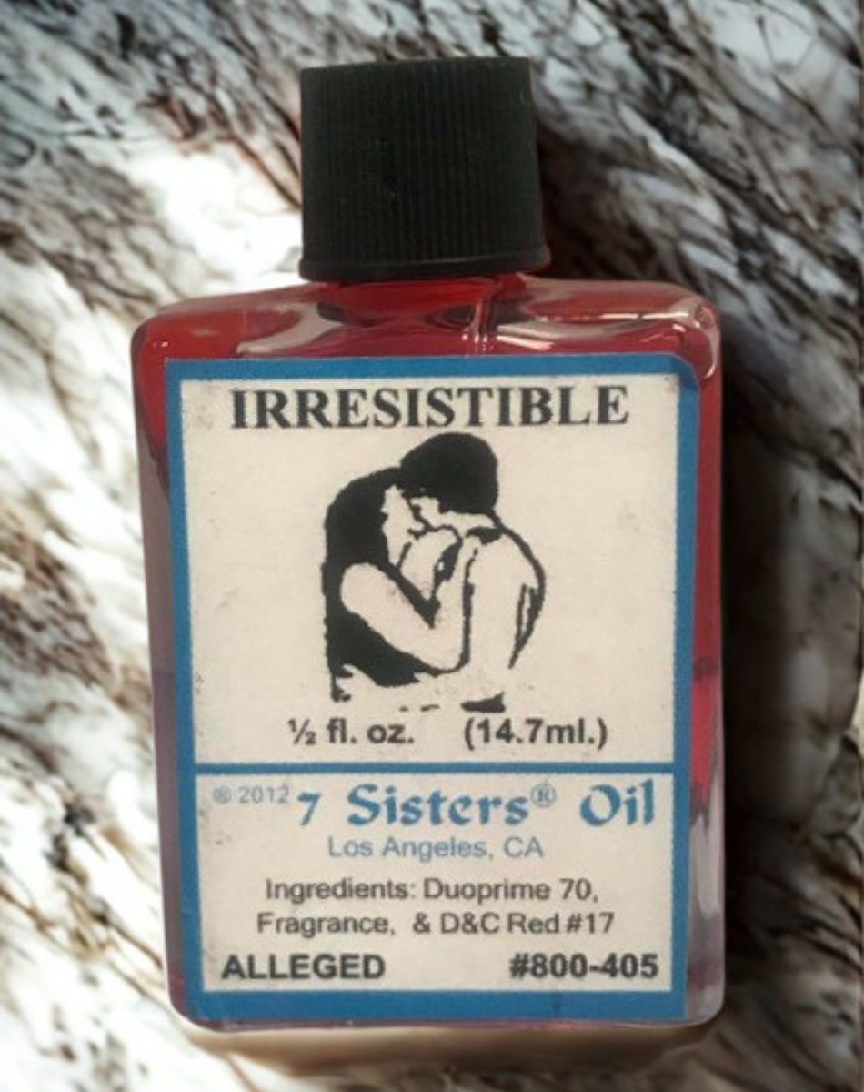 Irresistible Wish Oil spiritual oil bottle for candle dressing, intention setting, and ceremonial practice.