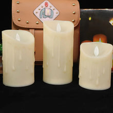 Ivory LED flameless pillar candle set with moving wick for mantel decoration, soft lighting, and seasonal decorating.