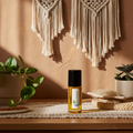 Kim Kardashian Body Oil bottle — warm amber, rose, jasmine, and sandalwood glamorous feminine fragrance.