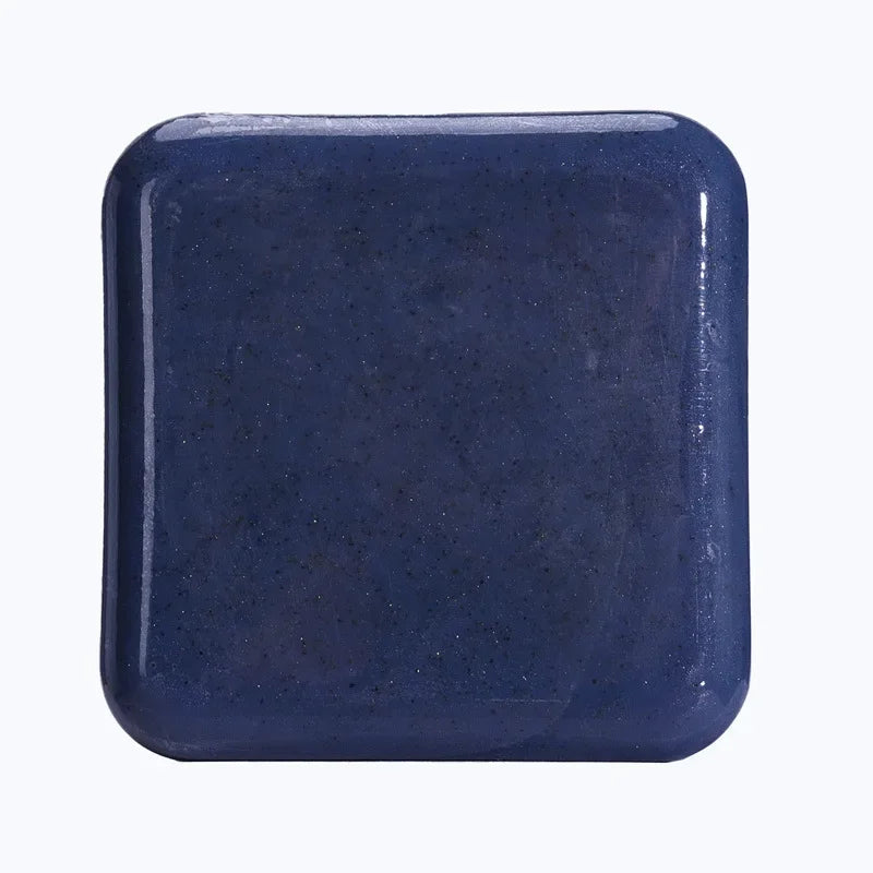 Kojic Acid & Sweet Orange Brightening Scrub Soap navy blue square bar tile on white background.