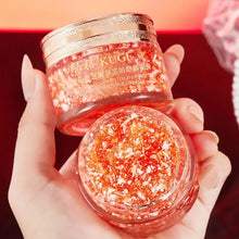 KUGE Dragon Blood Retinol Deep Moisture Face Cream two jars held by hand on red background.