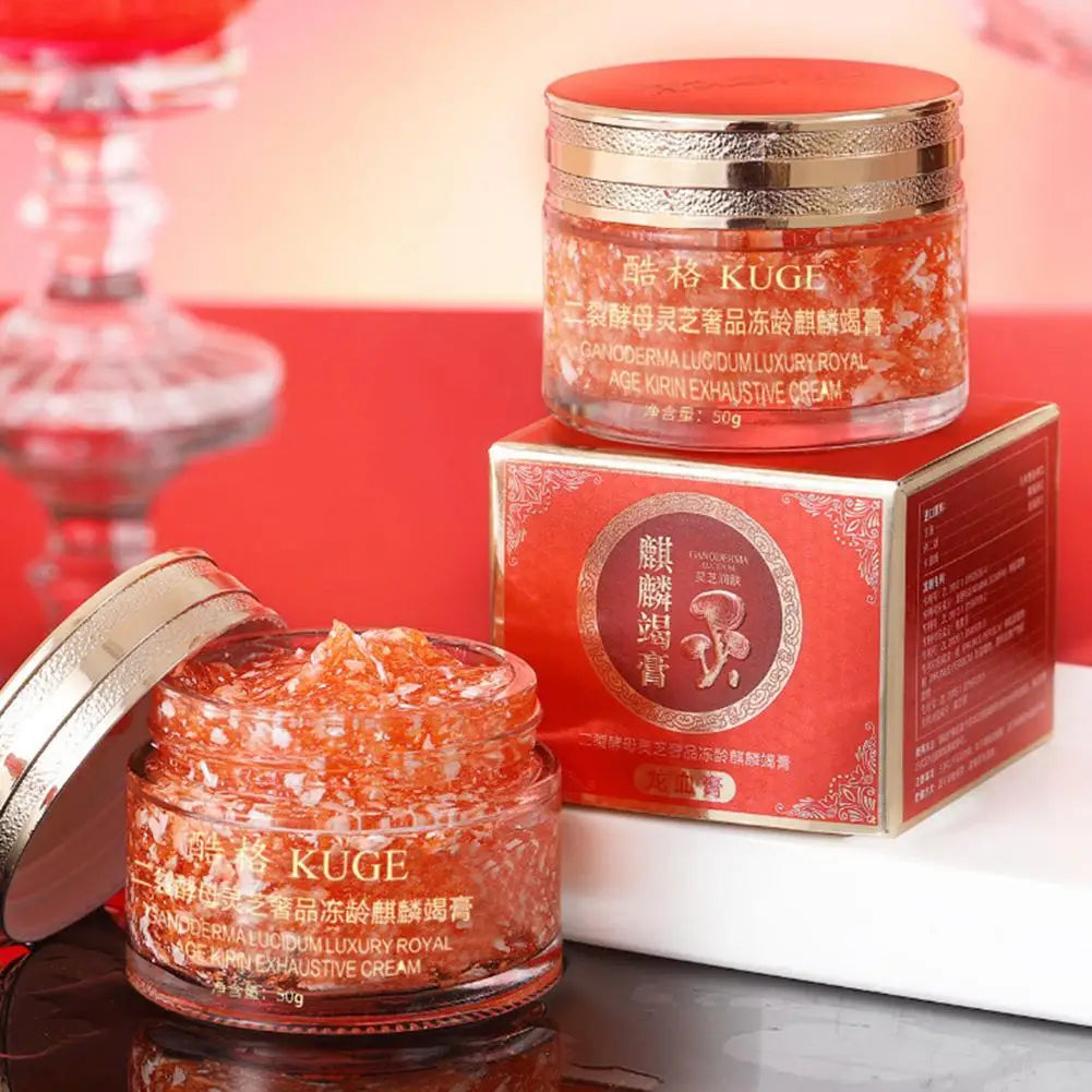 KUGE Dragon Blood Retinol Deep Moisture Face Cream jar with red lid and packaging on reflective surface.